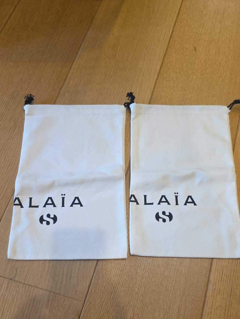 ALAÏA Superga White Thick Canvas Shoe Bags (Set of 2)
